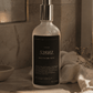 Bottle of 528Hz Meditation Mist on a bathroom counter with a warm light.