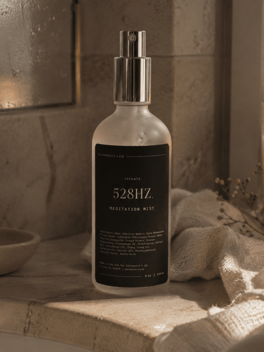 Bottle of 528Hz Meditation Mist on a bathroom counter with a warm light.