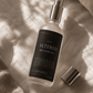 Bottle of 'Altered Meditation Mist' on a textured surface.