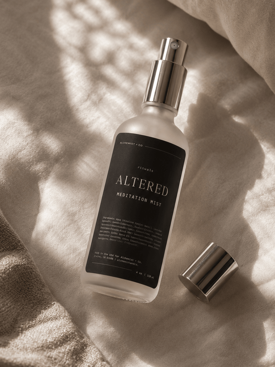 Bottle of 'Altered Meditation Mist' on a textured surface.