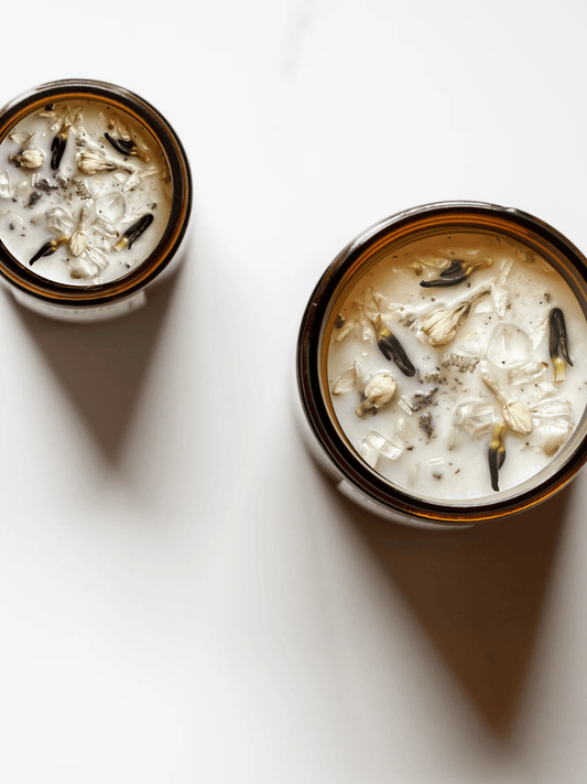Top view of Breathwork ritual candles with quartz and botanicals.