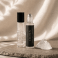 Crown Chakra Balancing Roller with quartz by Alchemist + Co. on neutral background.