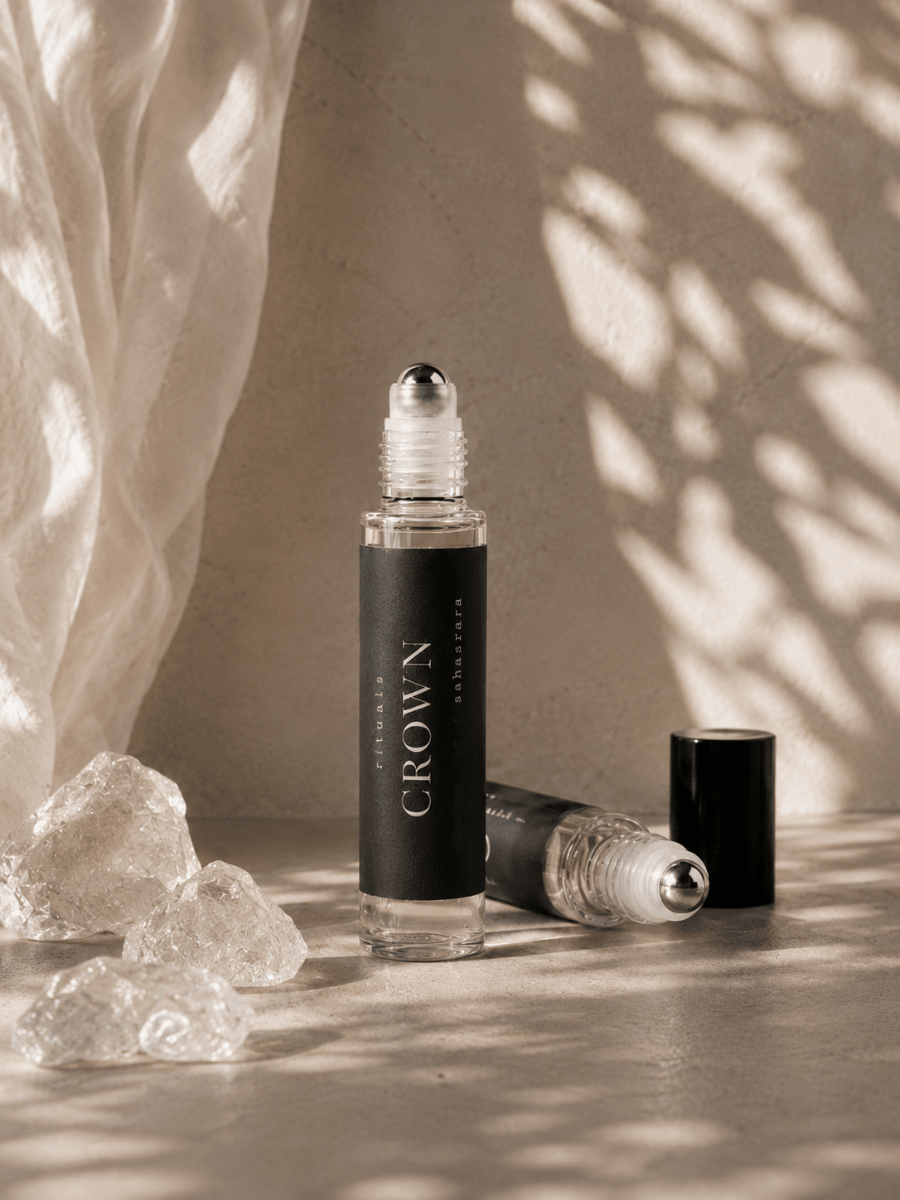 Crown Chakra Balancing Roller with quartz by Alchemist + Co. on neutral background.