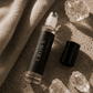 Crown Chakra Balancing Roller with quartz by Alchemist + Co. on neutral background.