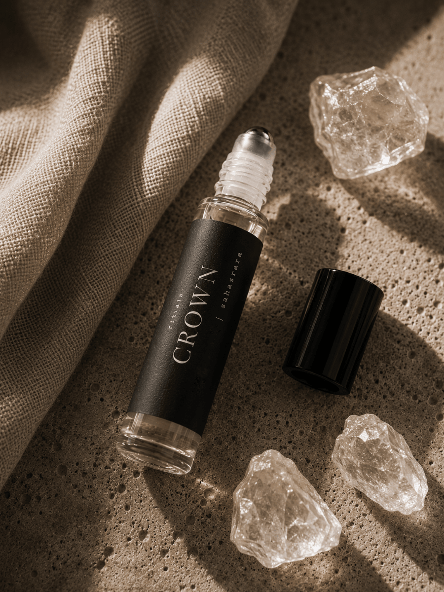 Crown Chakra Balancing Roller with quartz by Alchemist + Co. on neutral background.
