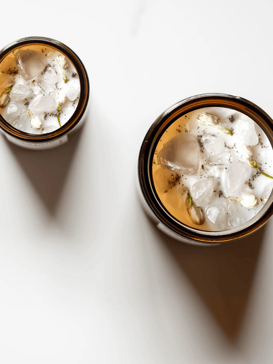 Drift ritual candles with rose quartz, quartz, and botanicals.