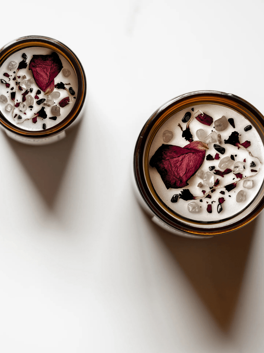 Top view of Ethereal ritual candles with rose quartz, hematite, quartz, and botanicals.
