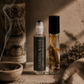 Two small bottles labeled 'Florida Water' on a textured surface with a warm, earthy background.