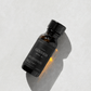 Bottle of 'Goddess ' ritual oil on a light gray background.