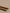 Two hand rolled Palo Santo incense sticks up close on a neutral surface.