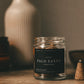Jar of Palo Santo incense cones on a wooden surface with a blurred vase in the background.
