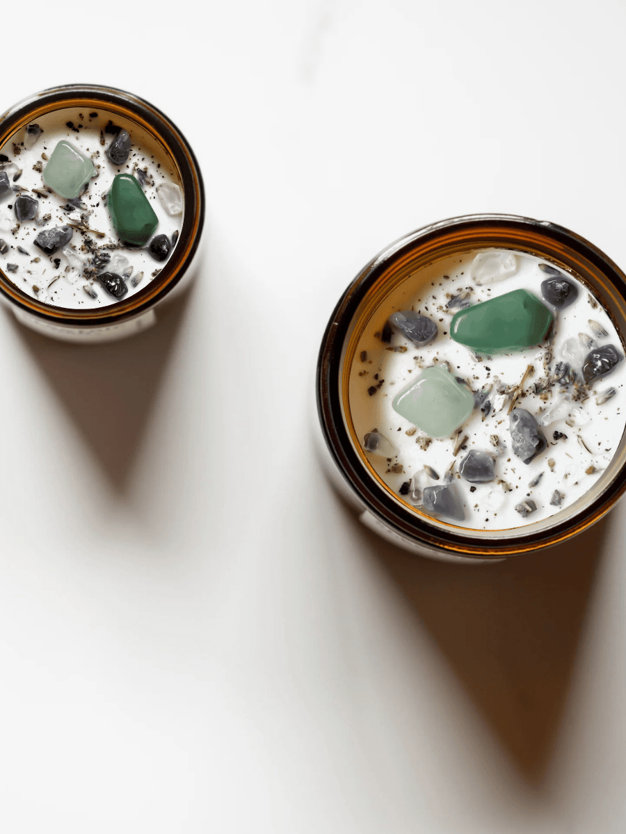 Top view of Heal ritual candles with green aventurine, amethyst, quartz, and botanicals.