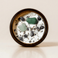 Heal ritual candle with green aventurine, amethyst, quartz, botanical details viewed from above.