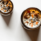 Top view of I. The Magician ritual candle with carnelian, tiger's eye, pyrite, and botanicals.