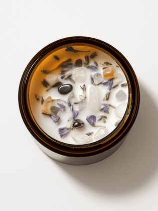 Top view of Yogi Ritual Candle by Alchemist + Co. with crystals and botanicals.