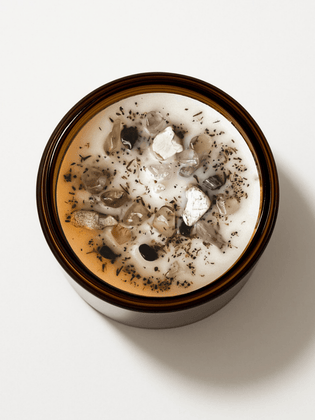 Top view of Alchemist + Co. Morning Affirmations II Ritual Candle with crystals and botanicals.