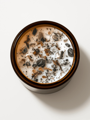 Top view of Alchemist + Co. Gaia Ritual Candle with crystals and botanicals.