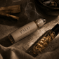 Two Palo energy cleansing rollers on neutral background by Alchemist + Co.