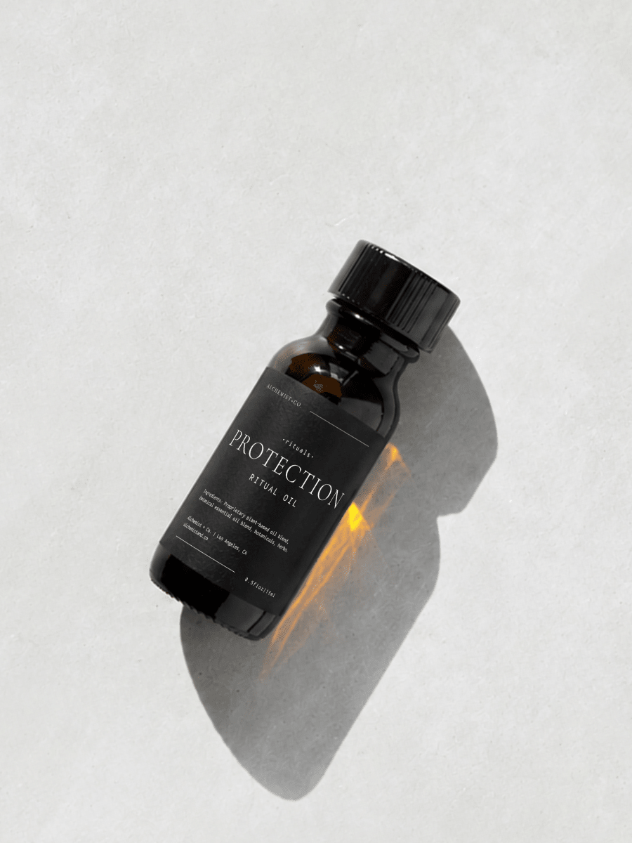 Bottle of 'Protection' ritual oil on a light gray background.
