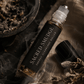 Sacred Smudge Cleansing Ritual Roller by Alchemist + Co. on a linen background with herbs and botanicals.