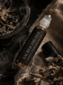 Sacred Smudge Cleansing Ritual Roller by Alchemist + Co. on a linen background with herbs and botanicals.