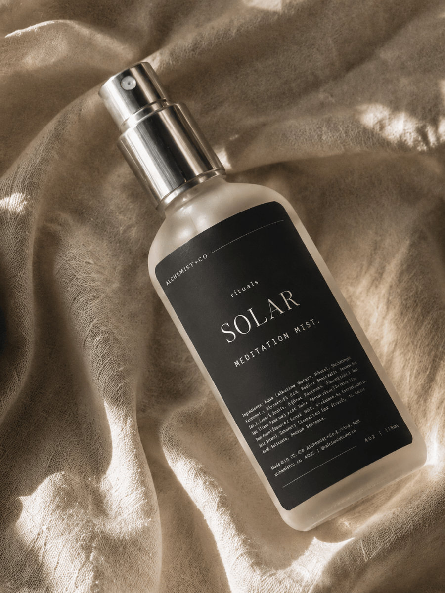 Solar Meditation Mist resting on textured linen fabric with soft natural shadows.