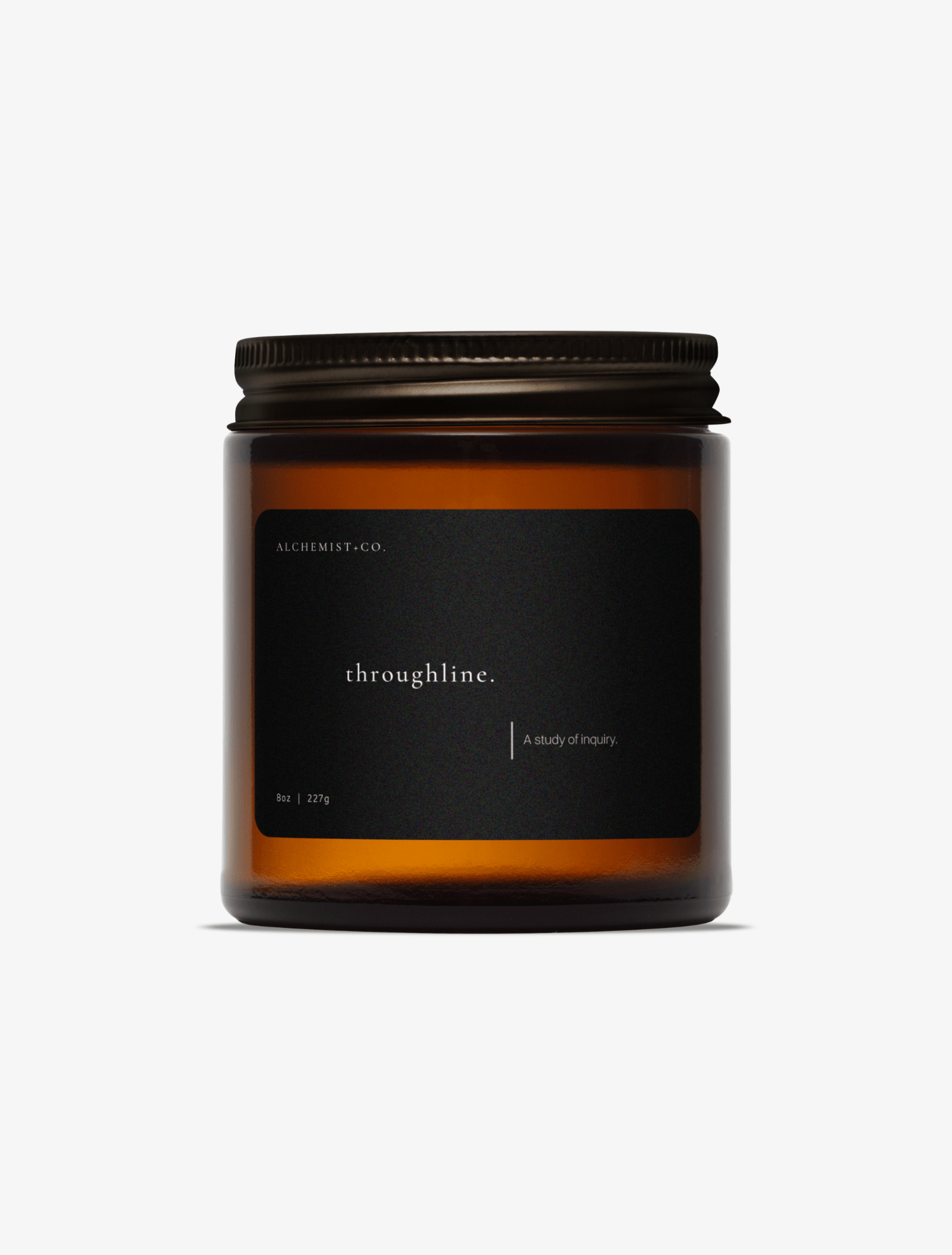An amber glass jar candle with a black label and a dark metal lid, centered on a light gray background. The label reads 'Throughline'.