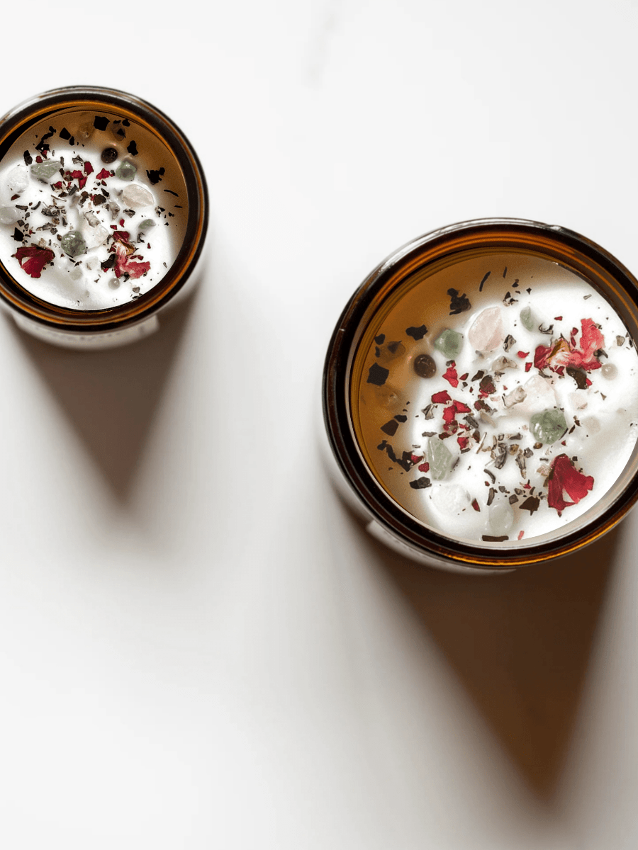 Top view of VI. The Lovers ritual candle with rose quartz, smoky quartz, green aventurine, and botanicals.