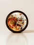 XIX. The Sun ritual candle with carnelian, rainforest rhyolite, citrine, quartz, and botanical details viewed from above.