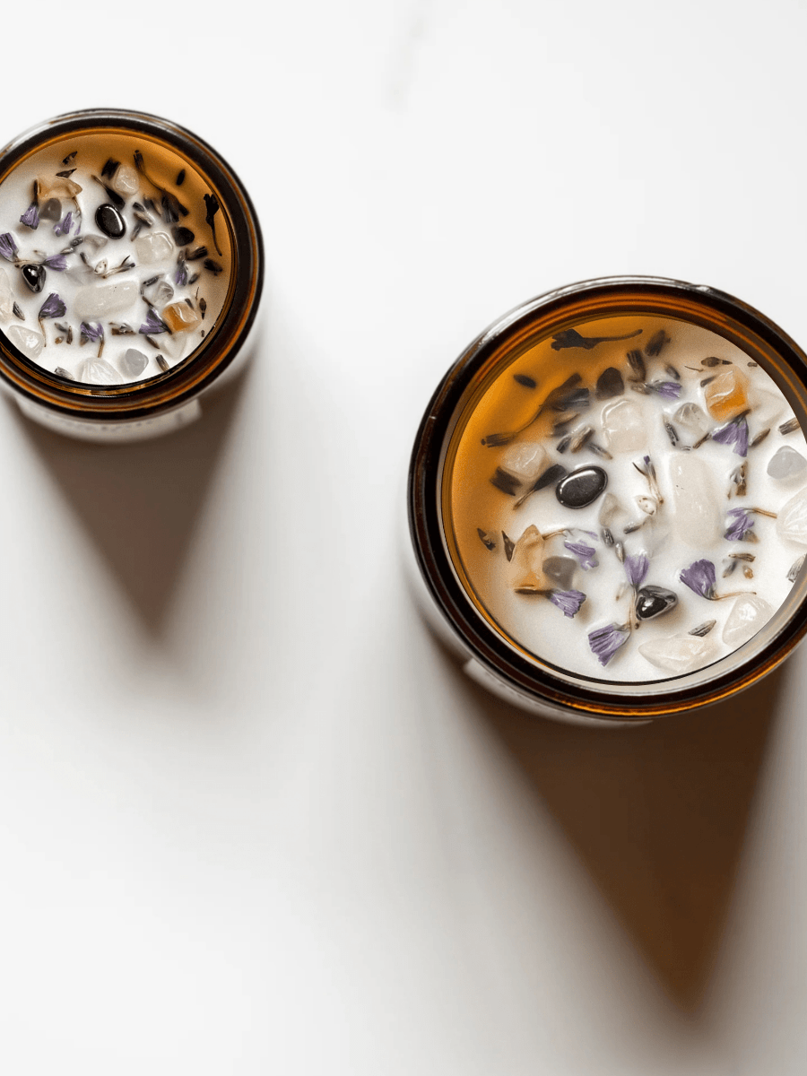 Top view of Yogi ritual candle with citrine, hematite, rose quartz, and botanicals.