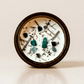 Zen ritual candle with malachite, black tourmaline, and botanical details viewed from above.